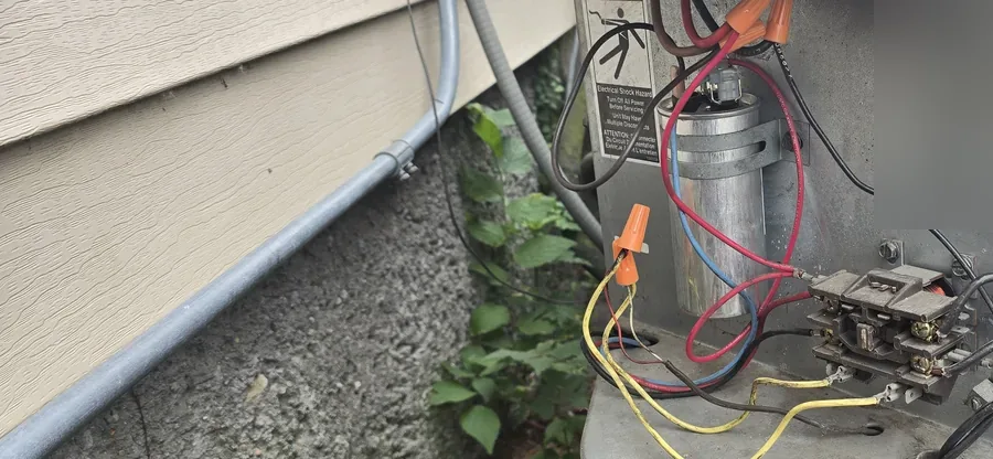 Rebuilt outdoor AC disconnect with new contactor, capacitor, and clean wiring