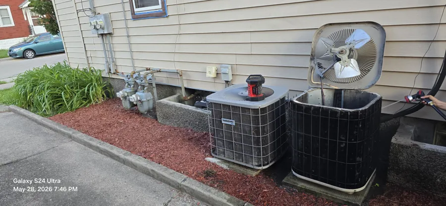 Residential air conditioner condenser serviced at a customer's home